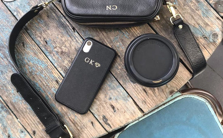 black iphone cases on rustic coffee table